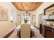 Dining room with wooden ceiling, chandelier, and furniture at 24 Beachwood West, Isle of Palms, SC 29451
