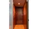 Private residential elevator with wood paneled walls and safety gate at 24 Beachwood West, Isle of Palms, SC 29451