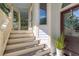 Charming front porch featuring stairs, a decorative door, and potted plants at 24 Beachwood West, Isle of Palms, SC 29451