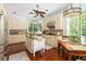 A spacious kitchen features granite countertops, stainless steel appliances and a kitchen island with seating at 24 Beachwood West, Isle of Palms, SC 29451