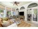 Sunroom featuring neutral decor, large windows, and a comfortable seating area with stylish furnishings at 24 Beachwood West, Isle of Palms, SC 29451