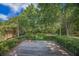 Beautiful backyard featuring a wooden deck, lush greenery, and a charming swing at 2418 Castlereagh Rd, Charleston, SC 29414
