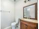 Bathroom with granite vanity, an ornate mirror and a glass-doored shower in the background at 2418 Castlereagh Rd, Charleston, SC 29414
