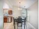 Bright dining area with modern table and chairs next to kitchen area with stainless steel appliances at 2418 Castlereagh Rd, Charleston, SC 29414