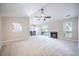 Spacious living room with vaulted ceiling, fireplace, and sliding glass doors to the outdoor space at 2418 Castlereagh Rd, Charleston, SC 29414