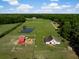 Expansive acreage with pond, fencing, outbuildings, and home with a country feel at 2470 Breakaway Trl, Johns Island, SC 29455