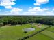 Beautiful acreage featuring a pond, fenced yard, outbuildings, and a well-maintained landscape at 2470 Breakaway Trl, Johns Island, SC 29455