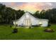 Inviting backyard with a patio, outdoor seating, fire pit, and lush lawn at 2470 Breakaway Trl, Johns Island, SC 29455