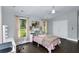 Cozy bedroom featuring a ceiling fan, natural light, warm-toned curtains, and styled décor at 2470 Breakaway Trl, Johns Island, SC 29455