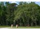 Grand entrance to a lush, private estate at 2470 Breakaway Trl, Johns Island, SC 29455