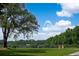 Expansive front lawn featuring mature trees and open space for outdoor activities at 2470 Breakaway Trl, Johns Island, SC 29455