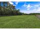 Lush green lawn with pristine white fencing at 2470 Breakaway Trl, Johns Island, SC 29455
