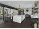 Open-concept kitchen featuring a large island, stainless steel appliances, and stylish pendant lighting at 2470 Breakaway Trl, Johns Island, SC 29455