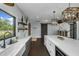 Bright kitchen featuring a large island, ample counter space, and modern fixtures and plenty of natural light at 2470 Breakaway Trl, Johns Island, SC 29455