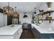 Modern kitchen with white countertops, dark cabinets, stainless steel appliances, and stylish open shelving at 2470 Breakaway Trl, Johns Island, SC 29455