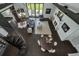 Aerial view of an open-concept living room with modern furniture and decor, spiral staircase, and outdoor access at 2470 Breakaway Trl, Johns Island, SC 29455