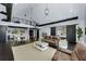 Open concept living space with kitchen, dining, living areas, and a spiral staircase at 2470 Breakaway Trl, Johns Island, SC 29455