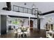 Open concept living space featuring a spiral staircase and a modern kitchen at 2470 Breakaway Trl, Johns Island, SC 29455