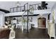 Spacious living area with a spiral staircase, kitchen and dining area in an open floor plan at 2470 Breakaway Trl, Johns Island, SC 29455