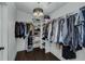 Walk-in closet with chandelier and built-in shelving for optimal organization at 2470 Breakaway Trl, Johns Island, SC 29455