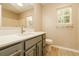 Bright bathroom with vanity, sink, mirror, and window providing natural light at 258 Trickle Dr, Summerville, SC 29483