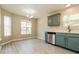 Bright kitchen featuring stainless steel appliances, white countertops, and painted blue cabinets at 258 Trickle Dr, Summerville, SC 29483