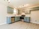Updated kitchen featuring stainless steel appliances, white countertops, and painted blue cabinets at 258 Trickle Dr, Summerville, SC 29483