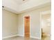 Spacious bedroom with tray ceiling, neutral walls, walk-in closet, and attached bath at 258 Trickle Dr, Summerville, SC 29483
