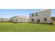 Expansive backyard features a well manicured lawn and the home's white exterior at 265 Wild Strawberry Ln, Moncks Corner, SC 29461