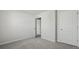 A spacious bedroom with neutral walls and plush carpeting, offering a serene and comfortable atmosphere at 265 Wild Strawberry Ln, Moncks Corner, SC 29461