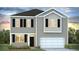 Charming two-story home with black shutters and a pristine two car garage at 265 Wild Strawberry Ln, Moncks Corner, SC 29461