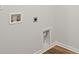 Laundry room features white walls, wood look flooring, and utility hook ups at 265 Wild Strawberry Ln, Moncks Corner, SC 29461