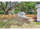 Fenced backyard featuring an outbuilding or shed with a pair of lawn chairs at 2678 Ranger Dr, North Charleston, SC 29405