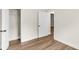 Bedroom featuring an open closet with wood floors and a view into the next room at 2678 Ranger Dr, North Charleston, SC 29405