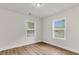 Inviting bedroom with natural light, wood floors, and two large windows at 2678 Ranger Dr, North Charleston, SC 29405