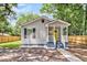 Charming exterior showcasing fresh paint, a welcoming covered porch and stylish design elements at 2678 Ranger Dr, North Charleston, SC 29405