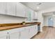 The kitchen features white cabinets, wood countertops, and stainless steel appliances at 2678 Ranger Dr, North Charleston, SC 29405