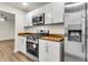 The kitchen features stainless steel appliances, white cabinets with wood countertops at 2678 Ranger Dr, North Charleston, SC 29405