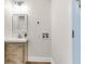 Efficient laundry room with modern vanity and wood-look flooring at 2678 Ranger Dr, North Charleston, SC 29405