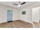 Cozy living room with modern ceiling fan and light blue entryway door at 2678 Ranger Dr, North Charleston, SC 29405