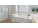 Bright and airy bathroom with a large soaking tub and a glass-enclosed shower at 2772 Latrobe Ct, Mount Pleasant, SC 29466