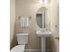 Powder room featuring a pedestal sink, oval mirror, and neutral paint at 2772 Latrobe Ct, Mount Pleasant, SC 29466