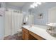 Well-lit bathroom with a single sink vanity and shower tub combo at 2772 Latrobe Ct, Mount Pleasant, SC 29466