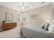 Bright bedroom featuring two windows, a dresser, and neutral decor at 2772 Latrobe Ct, Mount Pleasant, SC 29466