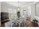 Dining room with hardwood floors and a glass-top table with seating for six at 2772 Latrobe Ct, Mount Pleasant, SC 29466