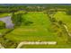 Aerial view of a meticulously maintained golf course with lush green fairways and pristine water hazards at 2772 Latrobe Ct, Mount Pleasant, SC 29466