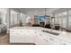 Stylish kitchen featuring white cabinets, stainless steel appliances, and an open design to the living room at 2772 Latrobe Ct, Mount Pleasant, SC 29466