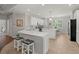 Beautiful kitchen with white cabinets, an island with bar stools, tile flooring and stainless steel appliances at 2772 Latrobe Ct, Mount Pleasant, SC 29466