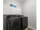 Laundry room with modern washer and dryer and storage cabinets at 2772 Latrobe Ct, Mount Pleasant, SC 29466