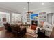 Inviting living room features a fireplace, built-in shelves, hardwood floors, and a comfortable seating area at 2772 Latrobe Ct, Mount Pleasant, SC 29466